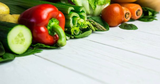 Close-up of various fresh raw vegetable on wooden table, copy space. Unaltered, veganism, organic, food, healthy, support, vegan day and celebration concept. - 写真・画像
