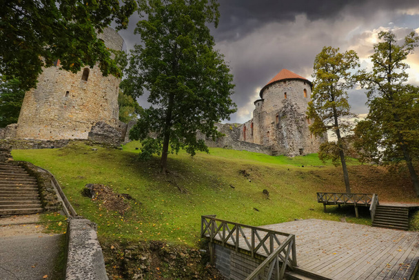 Autumn park and abandoned medieval castle in the town Cesis which has 800 years history and one of the mest well-preserved old town in Europe - Photo, image
