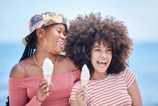 Friends, ice cream and happy at beach in summer for vacation, relax or holiday. Black woman, smile and cone for dessert at ocean together in sunshine for fun, happiness and break in Rio de Janeiro. - Fotó, kép