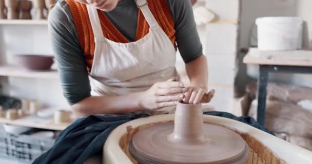 Pottery, woman creative and mold clay art piece for class, hobby or relax in workshop or studio. Creativity, girl student or female sculptor use wheel spinning, shape art or ceramic design workspace - Footage, Video