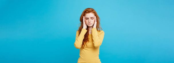 Healthcare Concept - Portrait of young beautiful ginger woman feeling sick and stressful. Isolated on pastel blue background. Copy space - Photo, Image