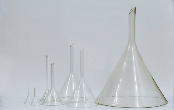 Funnels ,Different size of pharmaceutical funnels, large and small in row. - Zdjęcie, obraz