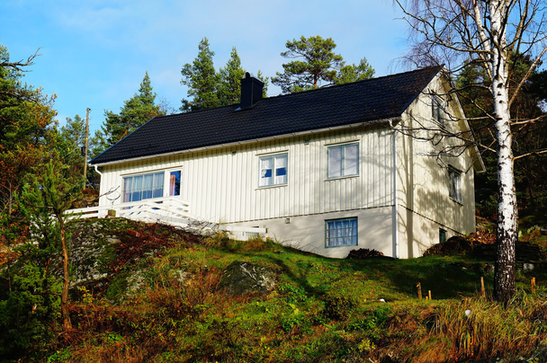 Norwegian white wooden residential house - 写真・画像
