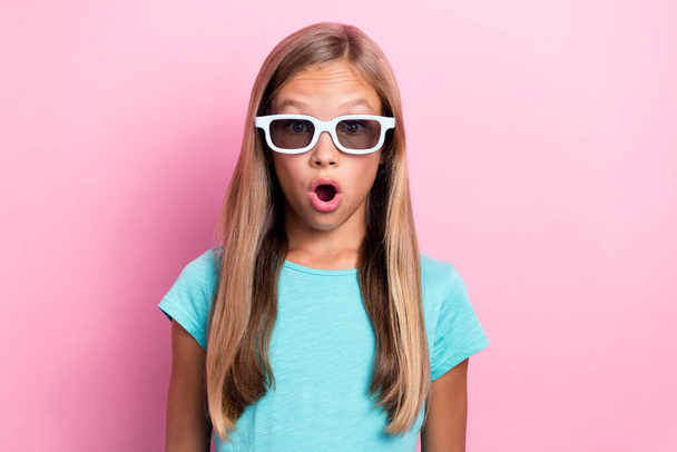 Photo of shiny impressed little child dressed teal t-shirt dark eyewear open mouth isolated pink color background. - Foto, Bild