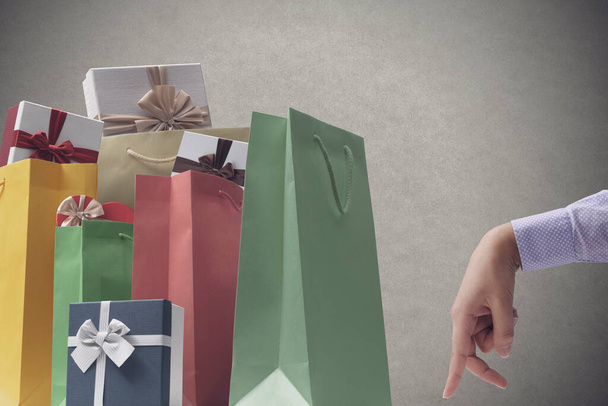 Gifts, shopping bags and walking fingers, shopping and celebrations concept - Foto, immagini