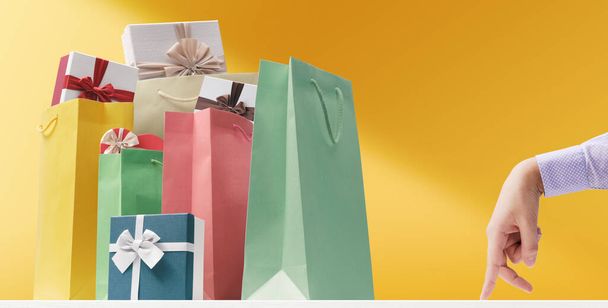Gifts, shopping bags and walking fingers, shopping and celebrations concept - Zdjęcie, obraz