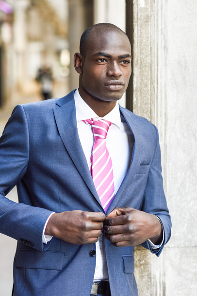 Handsome black man wearing suit in urban background - Photo, Image
