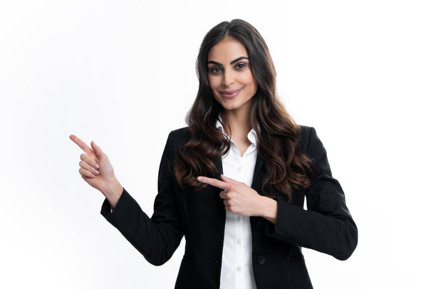 Female student, young teacher. Woman point at copy space, showing copyspace pointing. Promo, girl showing advertisement content gesture, pointing with hand recommend product. Isolated background - Foto, afbeelding