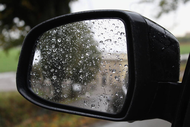 Rear view mirror of the car - driving in the countryside on an autumn day - Photo, Image