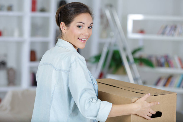 a woman moving in a house - Foto, Imagen