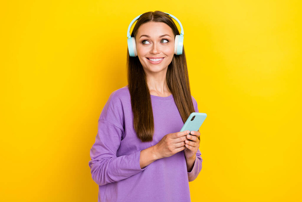 Photo of cute stylish lady hold modern device interested look empty space sale discount low price shop isolated on yellow color background. - 写真・画像