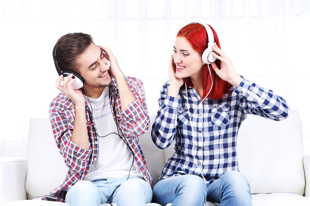Couple listen to music at home  - Foto, Bild