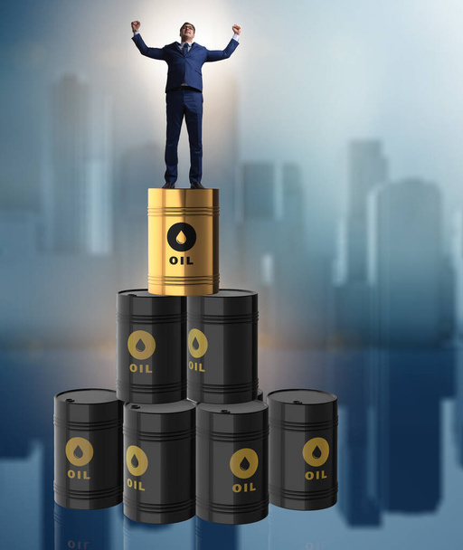 Ο επιχειρηματίας πάνω από βαρέλια πετρελαίου - Φωτογραφία, εικόνα