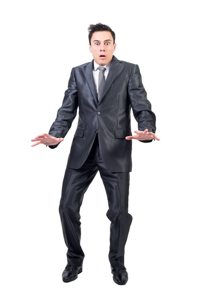 Full body of shocked male in elegant suit looking at camera with astonished face expression isolated on white background in studio - Photo, Image