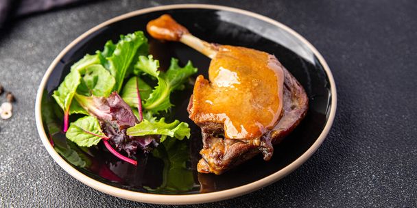 duck confit leg, red berry sauce  meal food snack on the table copy space food background  - Zdjęcie, obraz