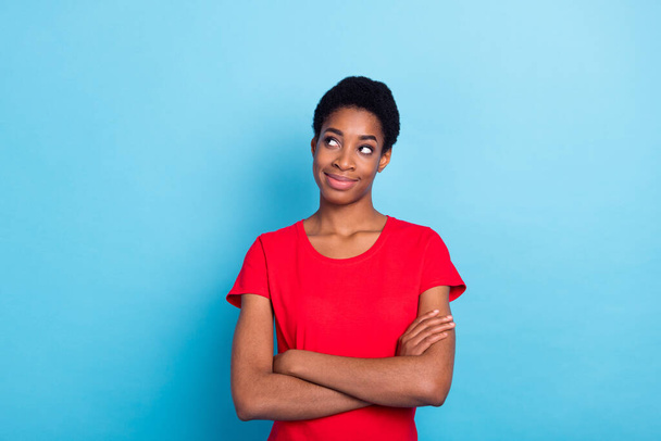 Photo of funky cheerful short hair person dressed red t-shirt arms folded looking empty space isolated blue color background. - 写真・画像