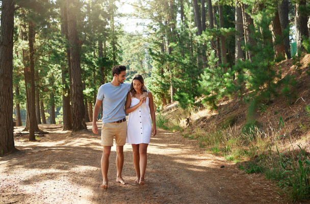I cant imagine losing you. an affectionate couple out for a walk through the forest - Foto, immagini