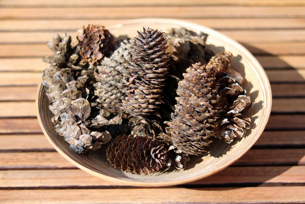 pine cones on wooden background - Photo, Image