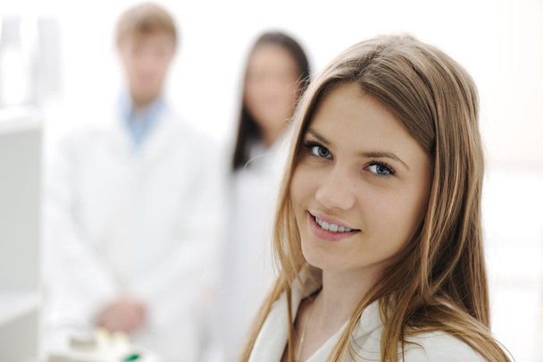Group of scientists working at the laboratory, young beauty female research - Фото, изображение