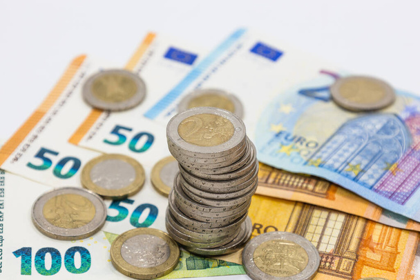Euro notes and stacked coins. Business, success, finance, money growth, and saving money concept. - Foto, imagen
