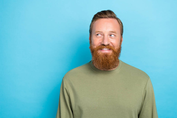 Portrait of funny optimistic cheerful guy with red hairdo dressed khaki pullover look empty space isolated on turquoise color background. - Φωτογραφία, εικόνα