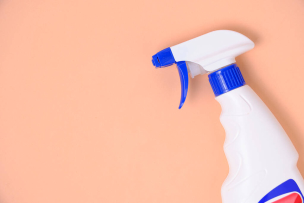 Sprayer for washing windows and plumbing beige background - Фото, зображення