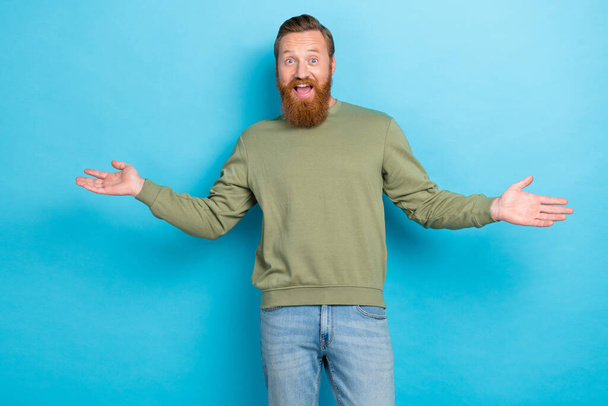 Portrait of confident guy with ginger hairdo wear khaki pullover open mouth glad to meet you isolated on turquoise color background. - Foto, Imagem