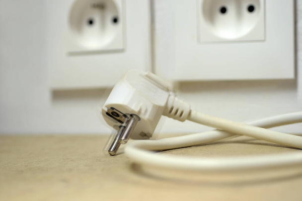 Electricity saving concept with an unplugged power outlet - Photo, Image