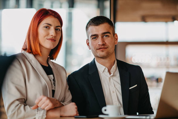Businessmen and businesswomen use modern devices, laptops, tablets and smartphones and arrange new projects for the job. High quality photo - Valokuva, kuva