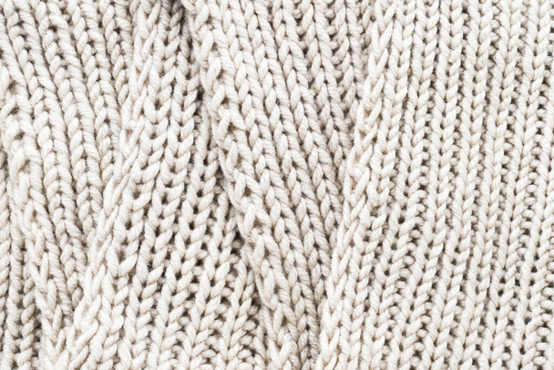 Knitted scarf. Vertical striped beige knit fabric texture, knitted pattern background. Top view - Fotoğraf, Görsel