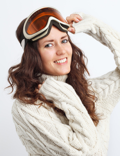 Portrait of young woman go in for winter sports over white backg - 写真・画像