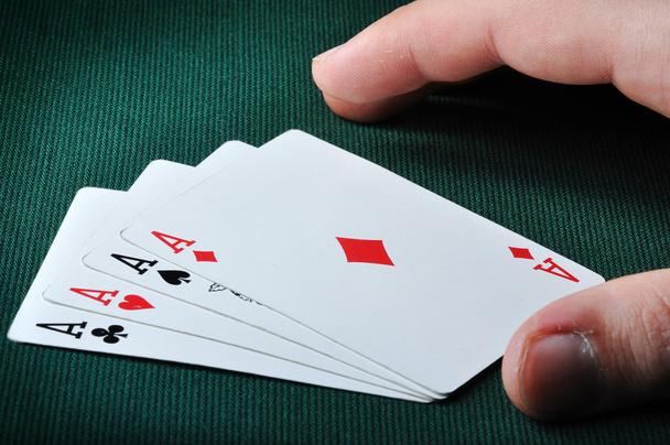 A card player is dealt a hand of four aces - Zdjęcie, obraz
