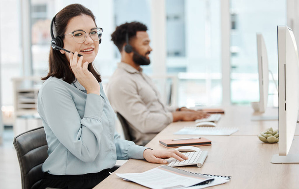 Call center, contact us and woman with headset at pc for customer service or telemarketing in office. Consultant, computer and female agent in CRM, communication and support agency with teamwork. - Φωτογραφία, εικόνα