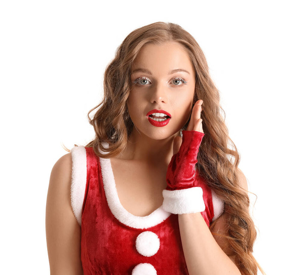 Surprised young woman in Santa costume on white background, closeup - Foto, imagen