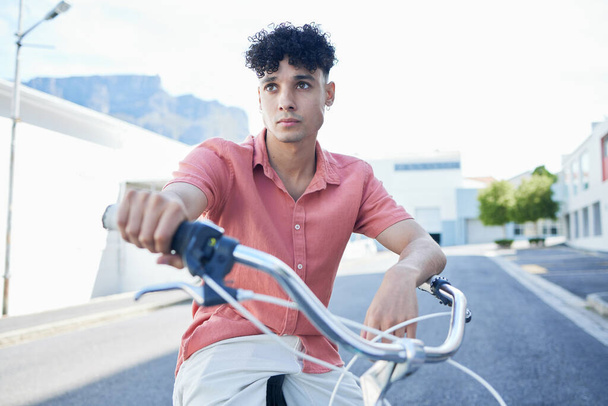 Bicycle, eco friendly travel and young man, active lifestyle and clean carbon footprint in cityscape. Gen z youth, cycle and commute, sustainability and environment, wellness and fitness outdoors - Fotoğraf, Görsel