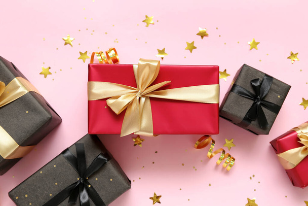 Gift boxes with confetti on pink background. Black Friday sale - Fotografie, Obrázek