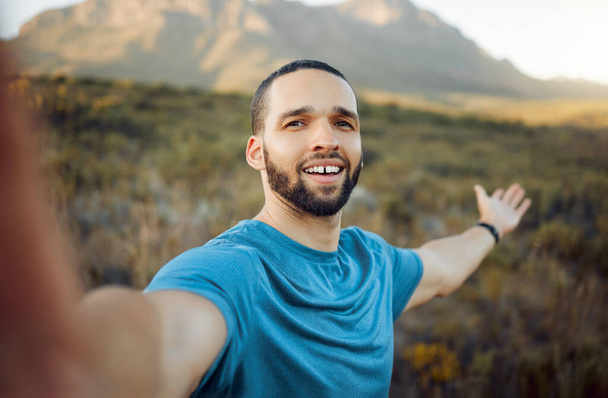 Nature hiking, selfie and influencer man live streaming for social media post, travel update and online landscape blog. Fitness, adventure pov person mountains trekking with 5g videography technology. - Fotó, kép