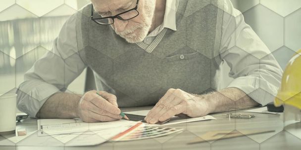 Architect working on a project and using a ruler, geometric pattern - Valokuva, kuva