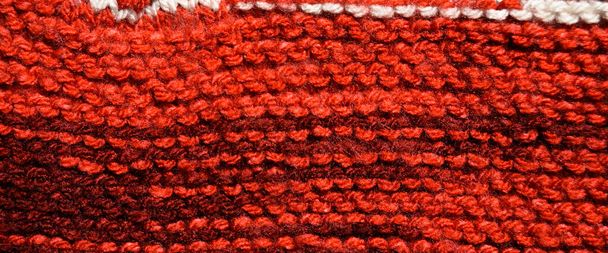 Pattern fabric made of wool. Handmade knitted fabric red wool background texture - Foto, immagini