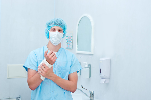 Surgeon preparing hands for surgery . - Φωτογραφία, εικόνα