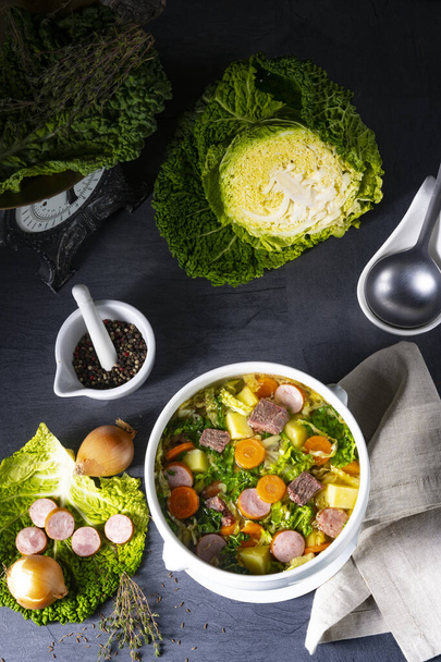 delicious savoy cabbage soup in white vase - Foto, afbeelding