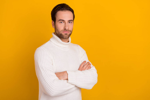 Photo of confident well-groomed masculine guy folded arms posing wear white sweater isolated yellow color background. - 写真・画像