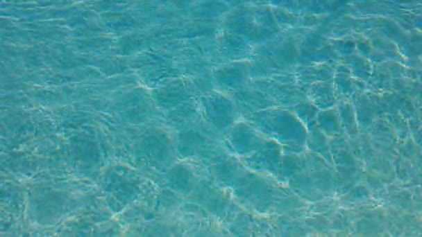 Pool swimming mask falling in the water. Clear water in sunny hot day. - Footage, Video