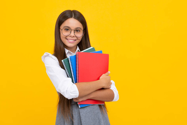 Teenager school girl study with books. Learning knowledge and kids education concept. Happy schoolgirl face, positive and smiling emotions - Fotoğraf, Görsel