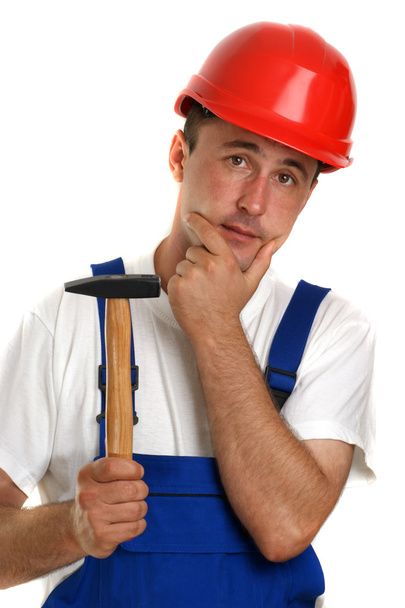 Craftsman with a white T-shirt holding a hammer - Photo, Image