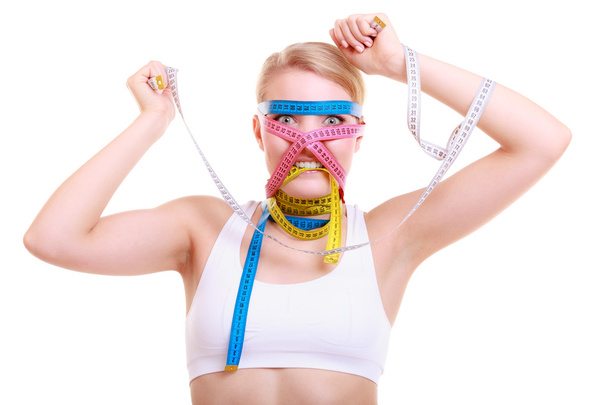 Woman with a lot of colorful measure tapes - Photo, Image