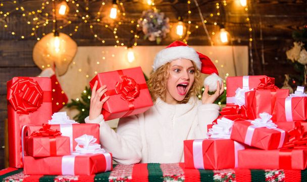 Thrilling emotions. December happy moments. Happiness and joy. Best wishes. Merry christmas and happy new year. Festive mood. Wrapped gifts. Happy smiling adorable woman and bunch of gifts boxes. - Фото, изображение