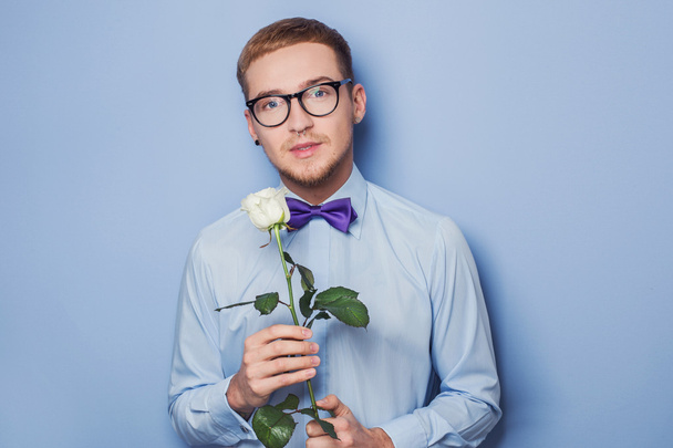 Cute young men with flower. Date, birthday, Valentine - 写真・画像