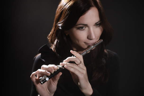 Woman with flute piccolo flutist - Photo, Image