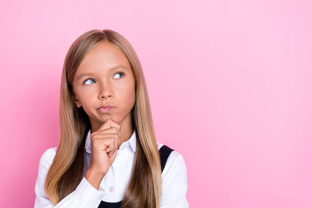 Closeup photo of young funny pretty face girlish little schoolkid lady touch chin pouted lips minded look empty space test isolated on pink color background. - Fotoğraf, Görsel